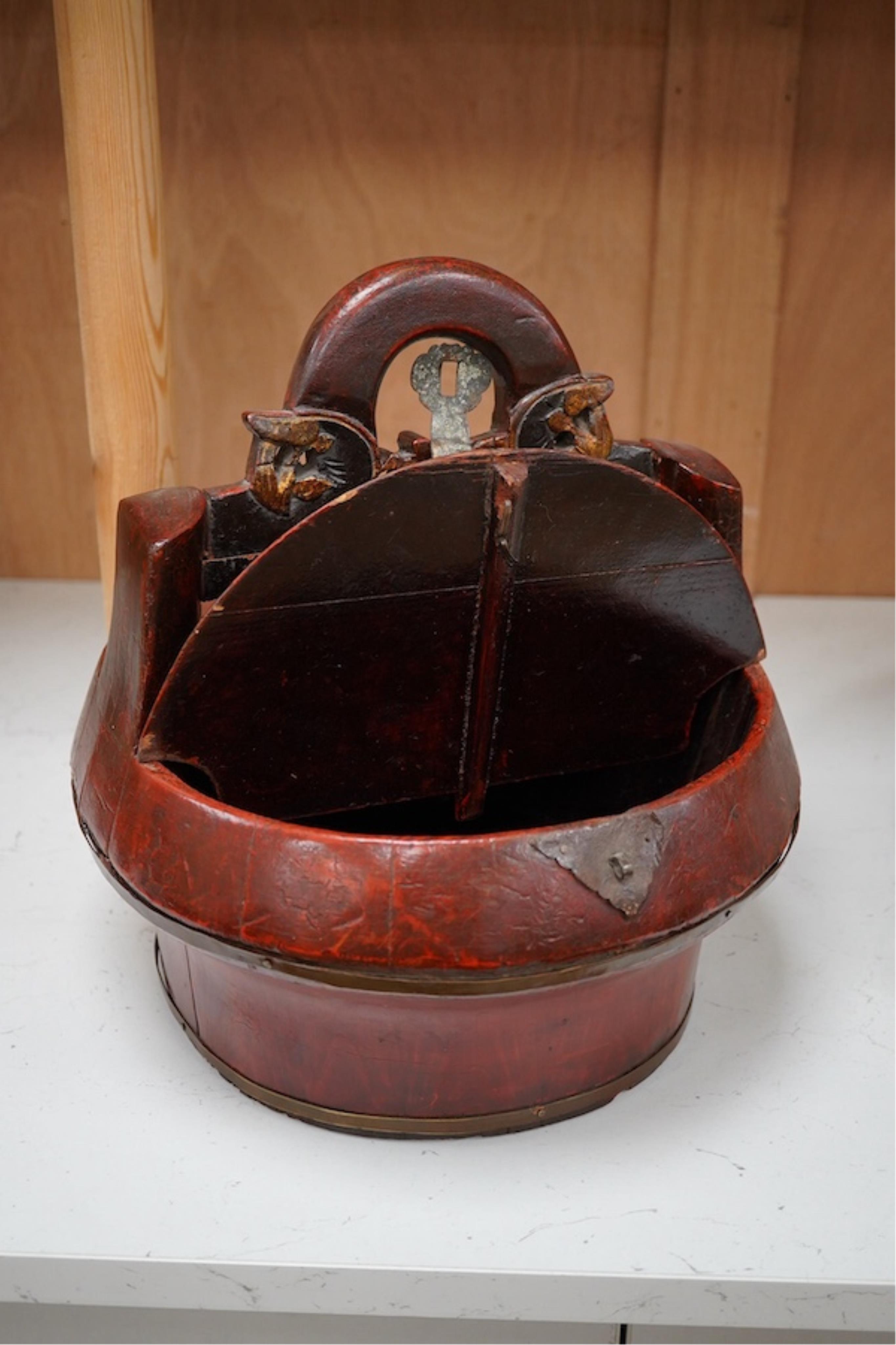 A Chinese red stained and carved food box, 29.5cm high. Condition - fair